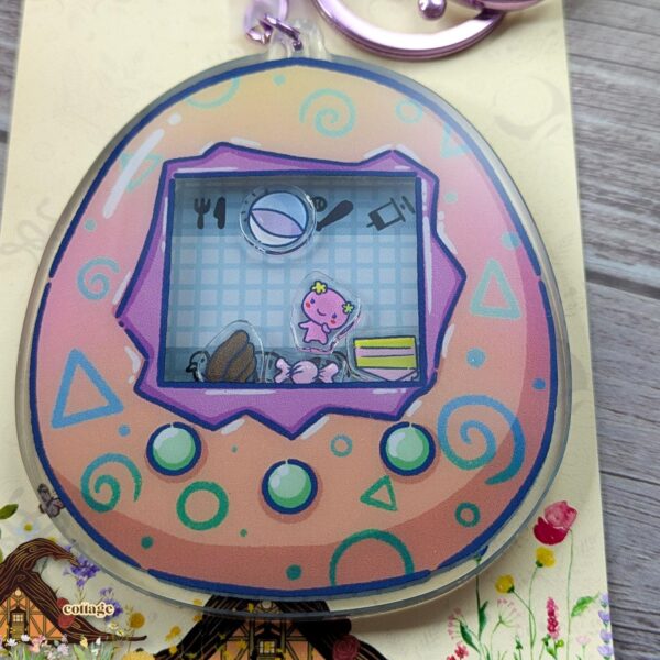 Violet Tama Shaker Keychain, 3.5" Key Chain, 90s Nostalgia, Virtual Pet Keyring – product photo 1
