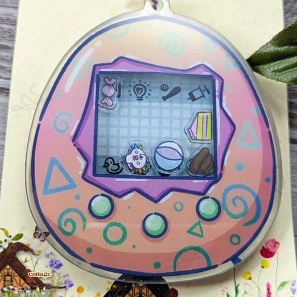 Woopa Tama Shaker Keychain, 3.5" Key Chain, 90s Nostalgia, Virtual Pet Keyring – product photo 1